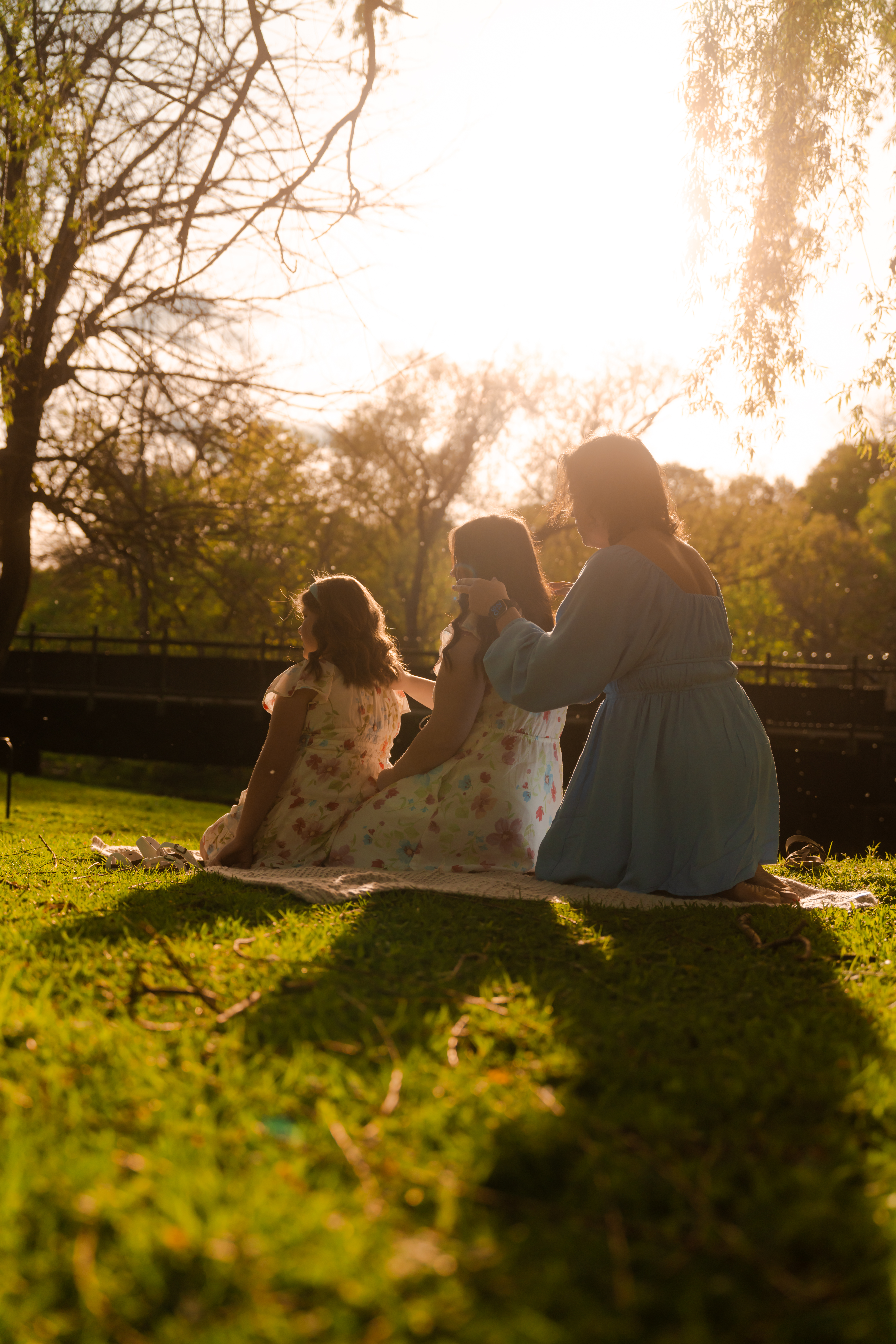 Family backlit in golden sunlight